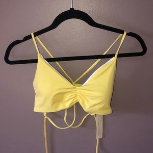 A XL yellow bathing suit top.